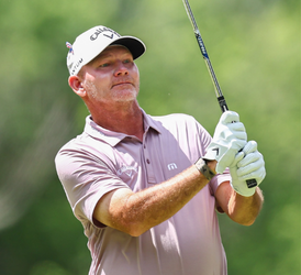 Tommy Gainey, male, swinging a golf club
