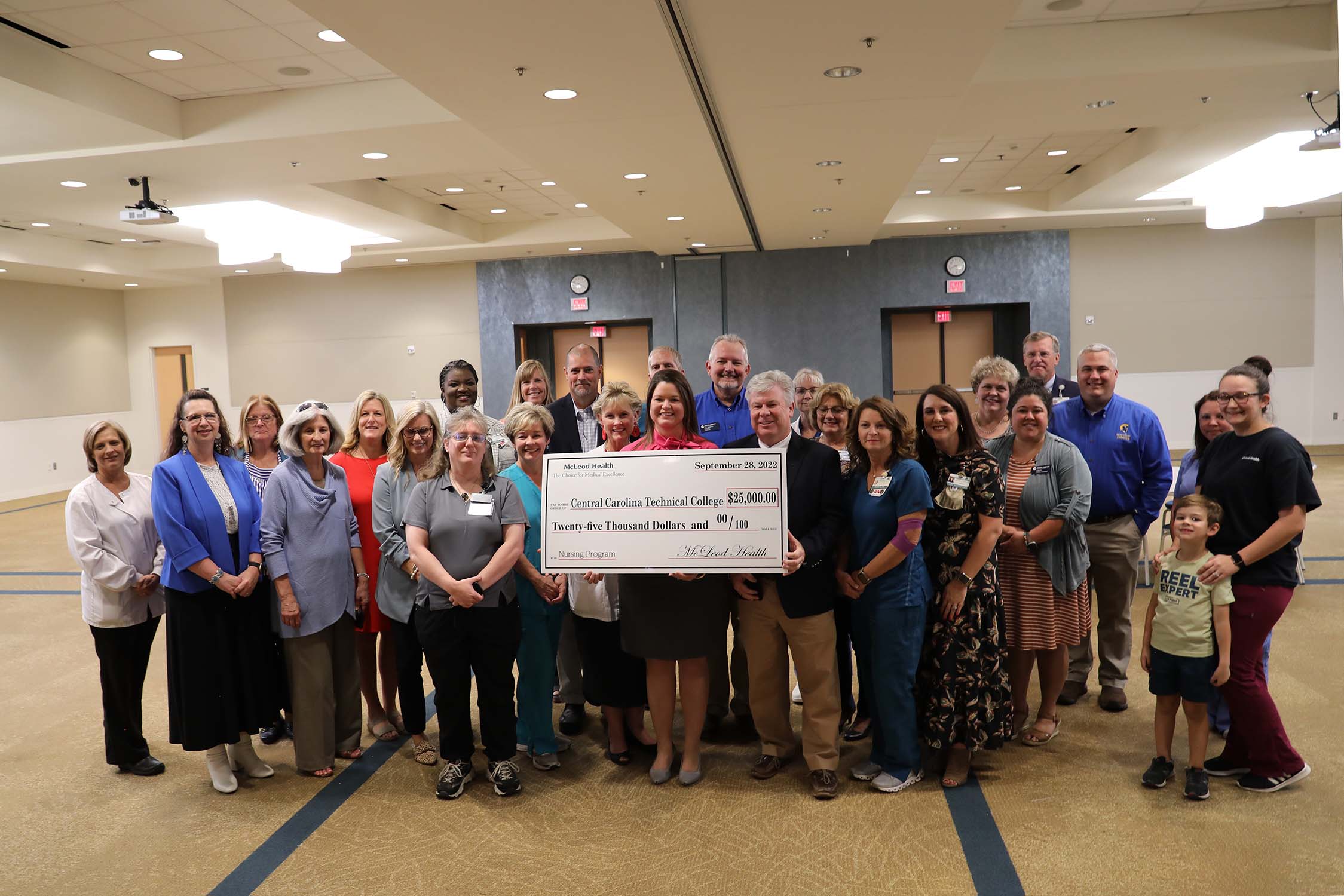 group photo of $25,000 donation at Health Sciences Center